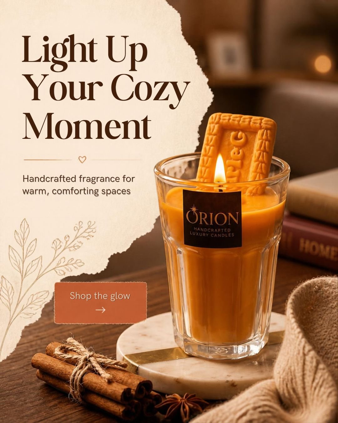 Amber candle in a clear glass tumbler, styled with cinnamon and soft knit fabric